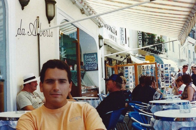 Hubby relaxing in a cafe on the Piazzetta, back in the day on our first trip there!